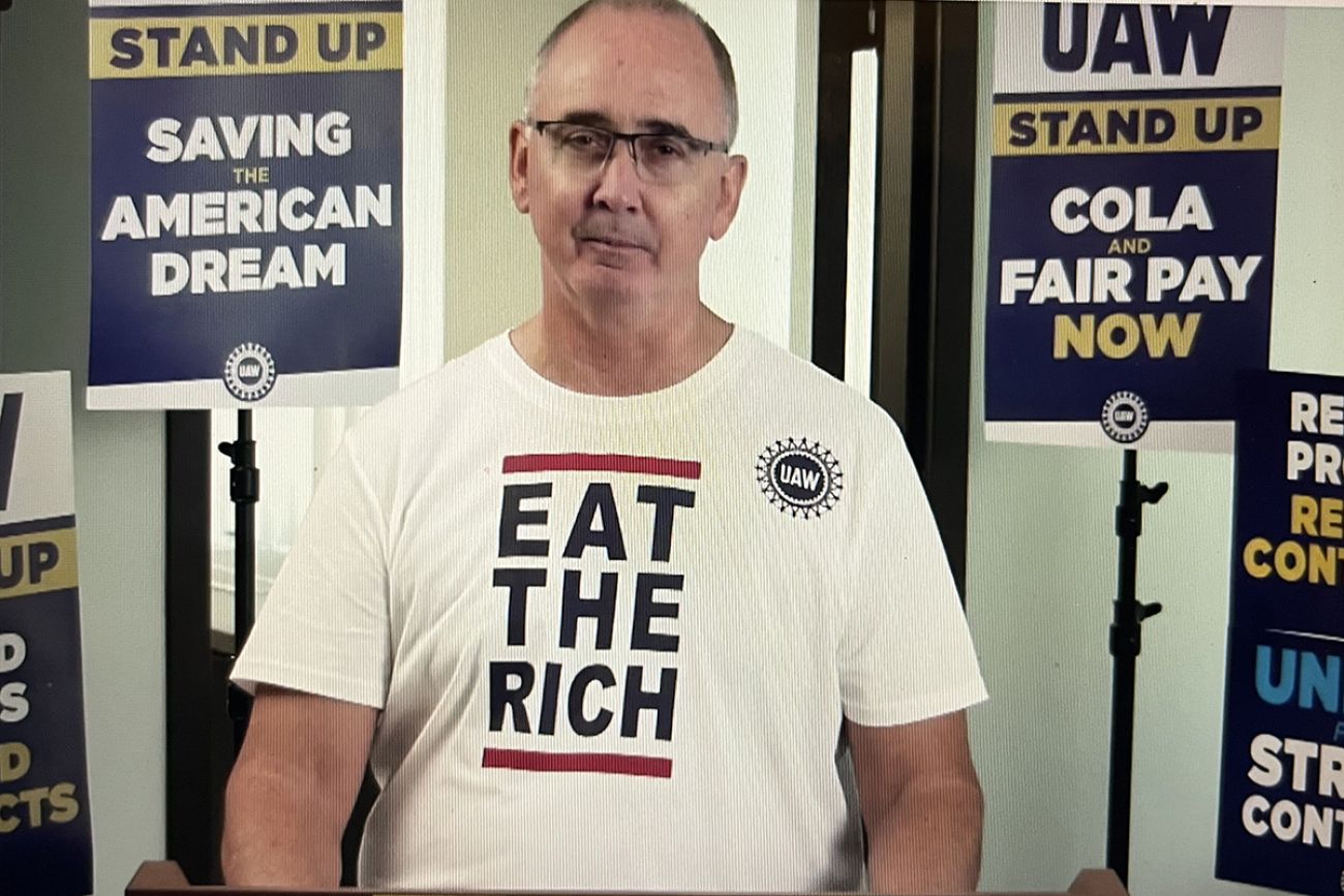 UAW President Shawn Fain wears an Eat the Rich shirt