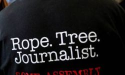 The back of a t-shirt saying "Rope. Tree. Journalist. Some Assembly Required."