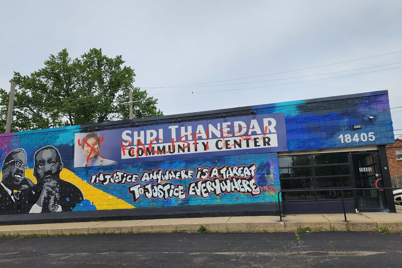 Defaced Shri Thander sign on the side of a community center in Detroit
