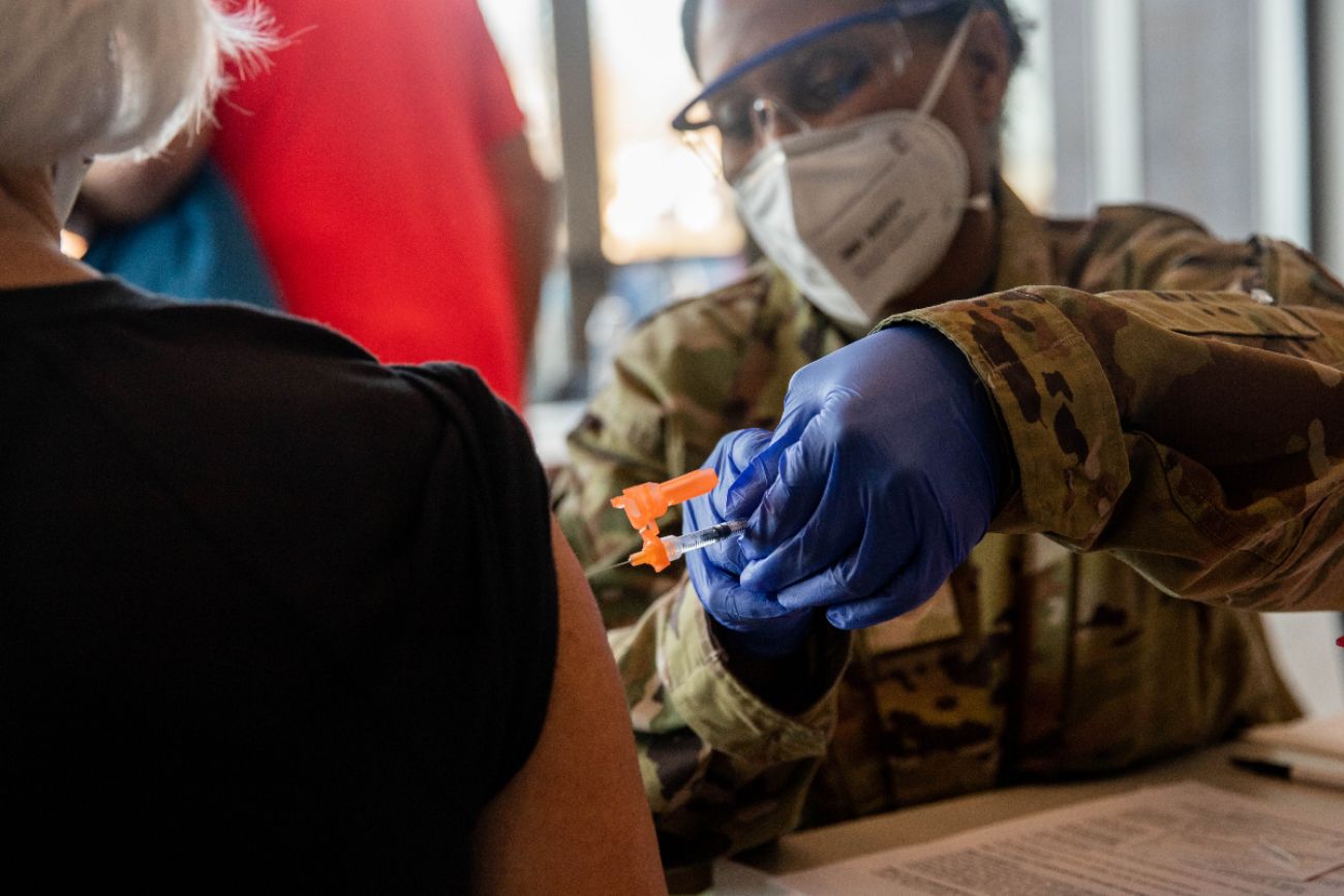 Staff Sgt. Ayanna McFaddin of the National Guard gives the Pfizer Biotech Covid-19 Vaccination on March 3 at the Holland Civic Center Place. A new CDC study underscores the effectiveness of the two-dose COVID vaccines once recipients are fully vaccinated. 