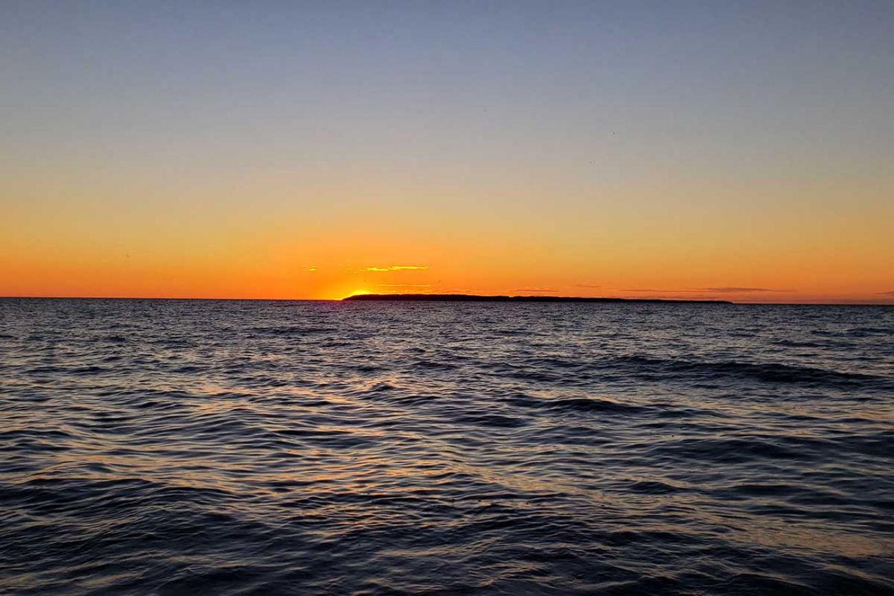 The sun sets over Lake Michigan
