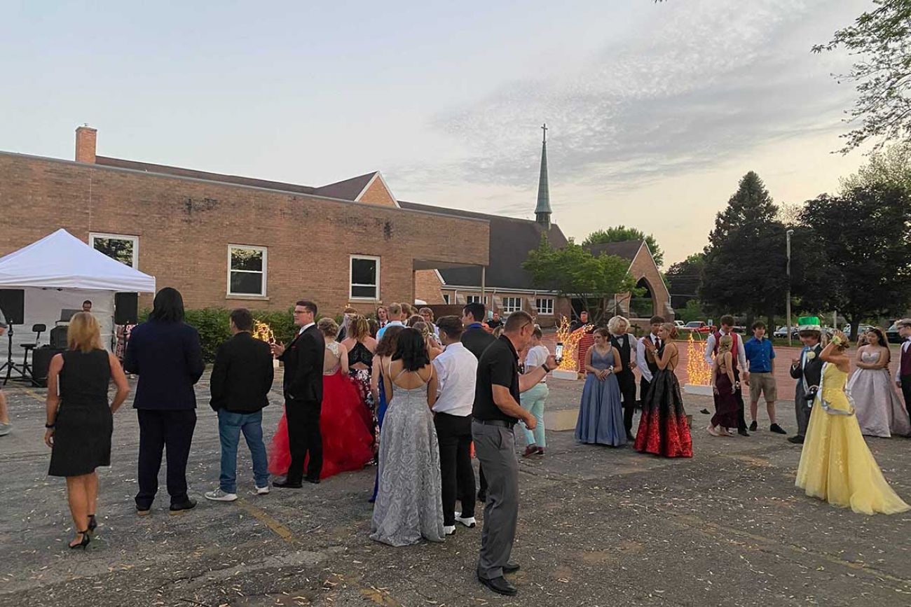 Students enjoy a pandemic-era prom in the backyard of Salem Lutheran Church in Coloma Saturday.