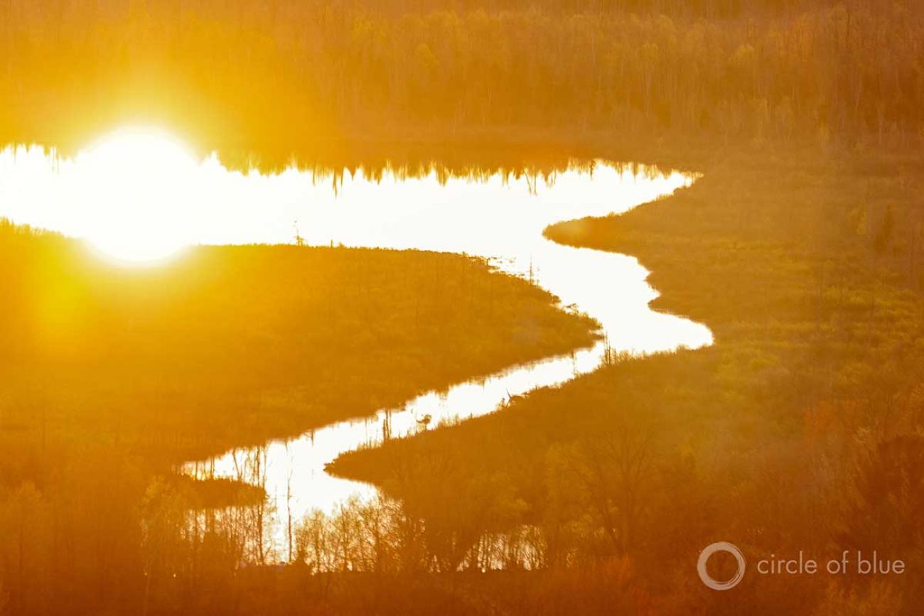 The sun rises over a wetland near Interlochen, Michigan