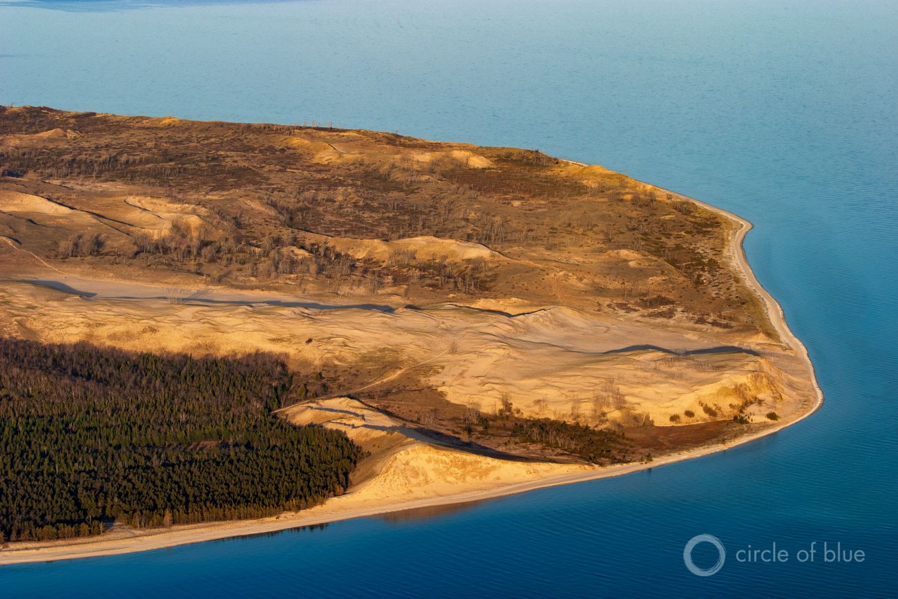 This aerial photo shows the undeveloped shoreline of the Sleeping Bear Dunes National Lakeshore on Lake Michigan