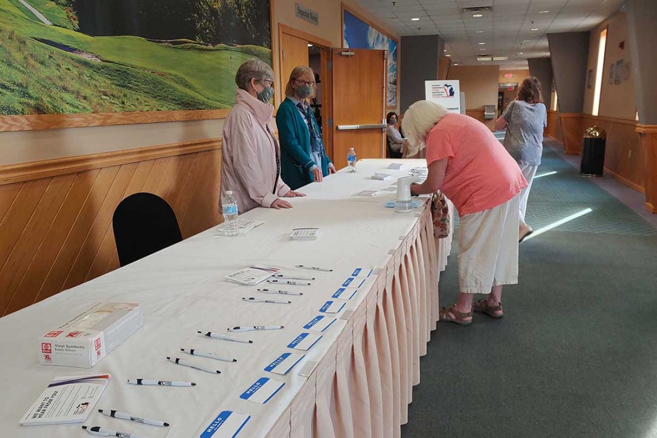 A resident signs up to speak in May at Michigan Independent Redistricting Citizens Commission hearing in Gaylord.