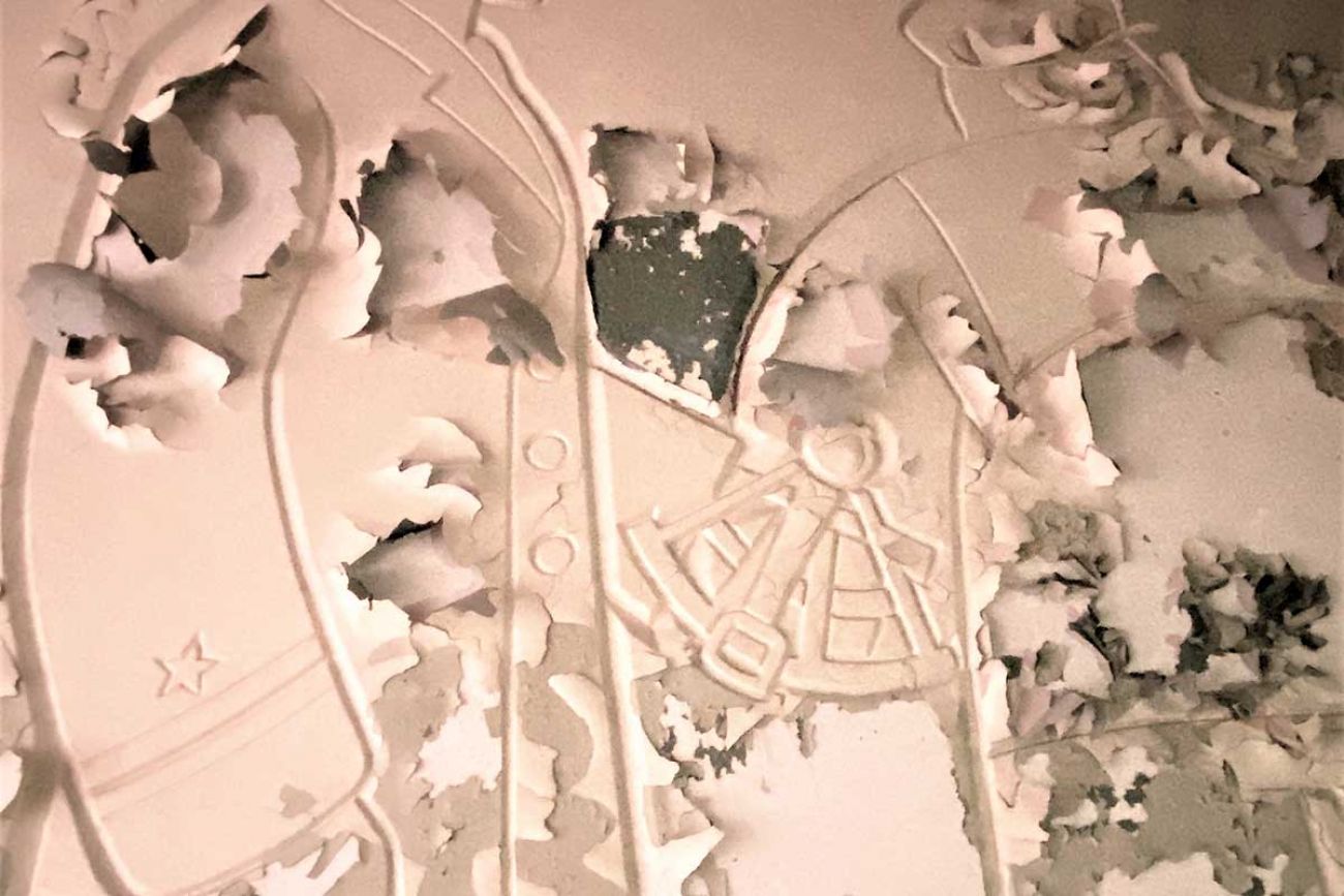 A wall carving by artist Gustave Hildebrand that’s peeling away. WPA-era art is often considered local and national treasures.