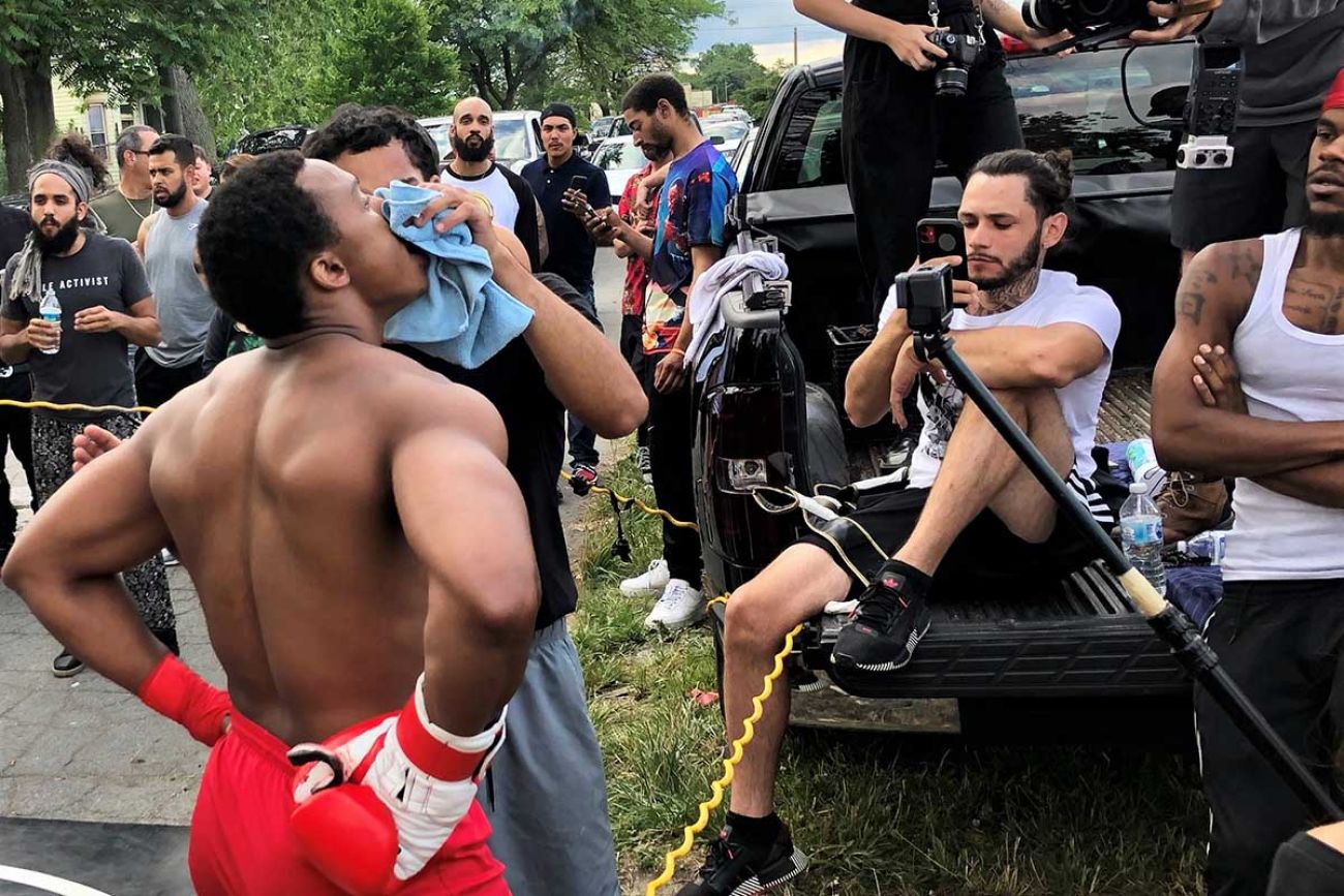 Organizer and boxer Dwayne Taylor attends to a fellow boxer with a bloodied nose. The weekly event gains more attention with each outing