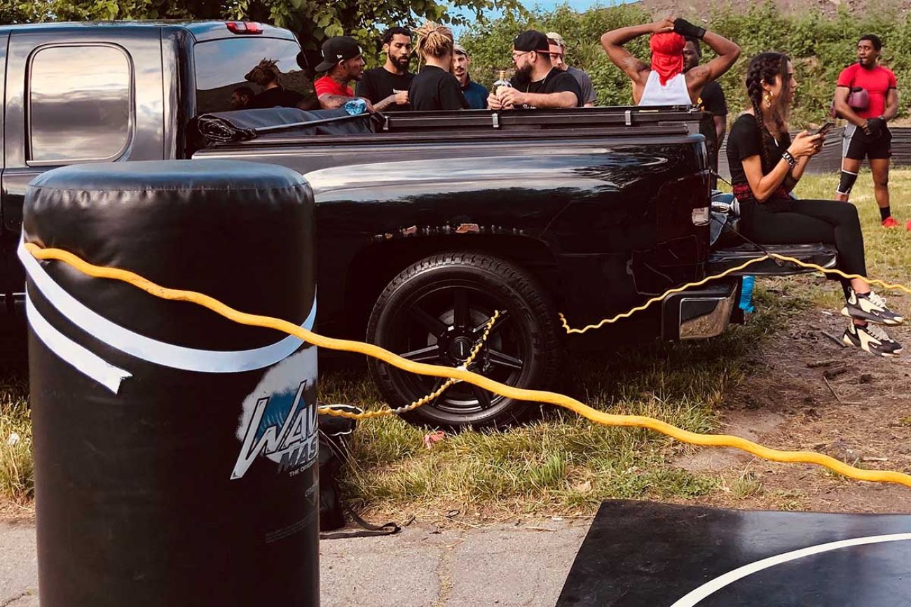 One corner of the boxing ring was tied to the rim of a Chevy Silverado. 