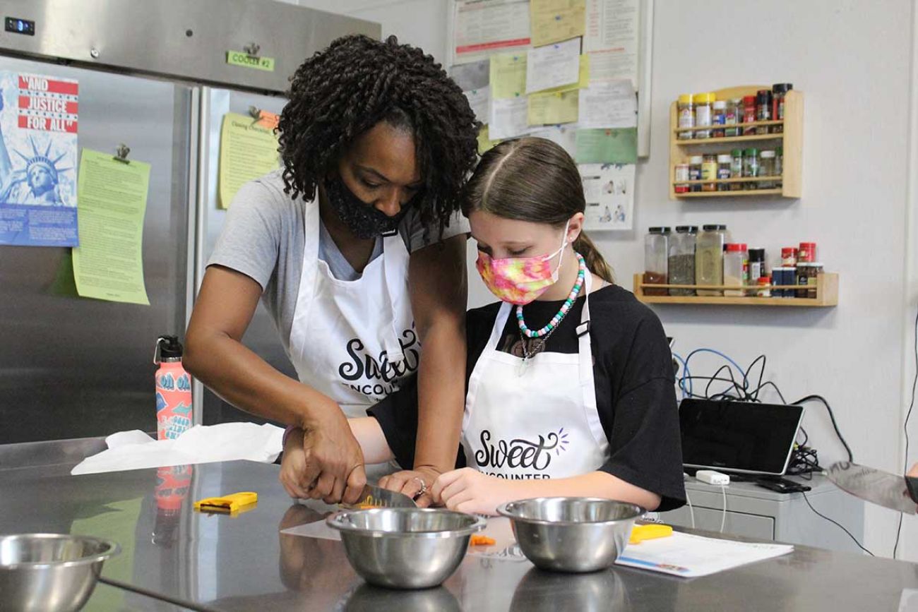 Nikki Thompson Frazier with a kid