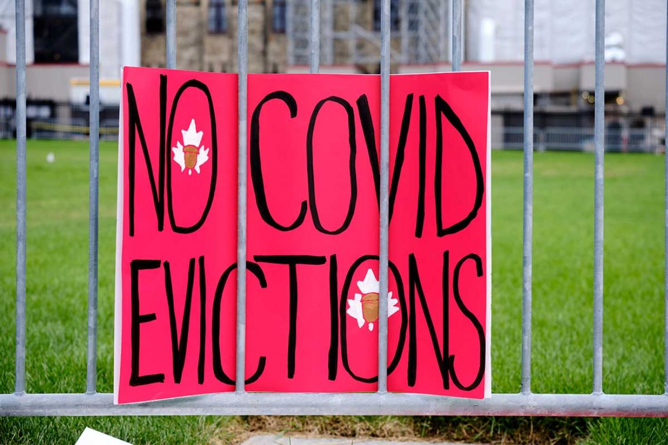 poster stating "no covid evictions"