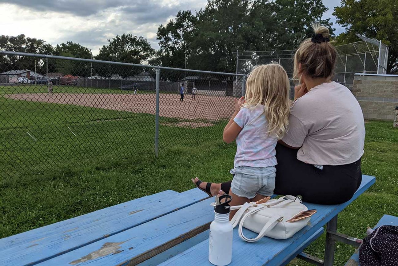 Kala Kelly, 31, watches her son Brock, 9, practice at a ball field in Taylor earlier this week