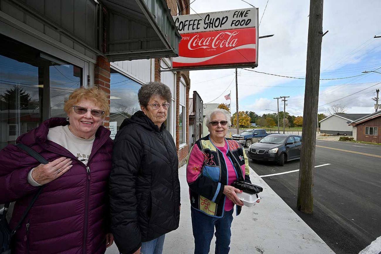 Beverly Sharp, Janice Roberts and Bonnie Norris pause outside the Ginofli's coffee shop 
