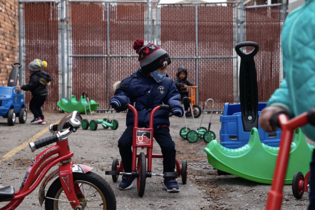 kid riding a scooter 