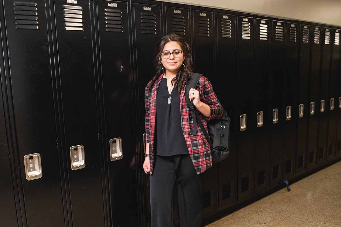 Jackie Calderon in front of lockers