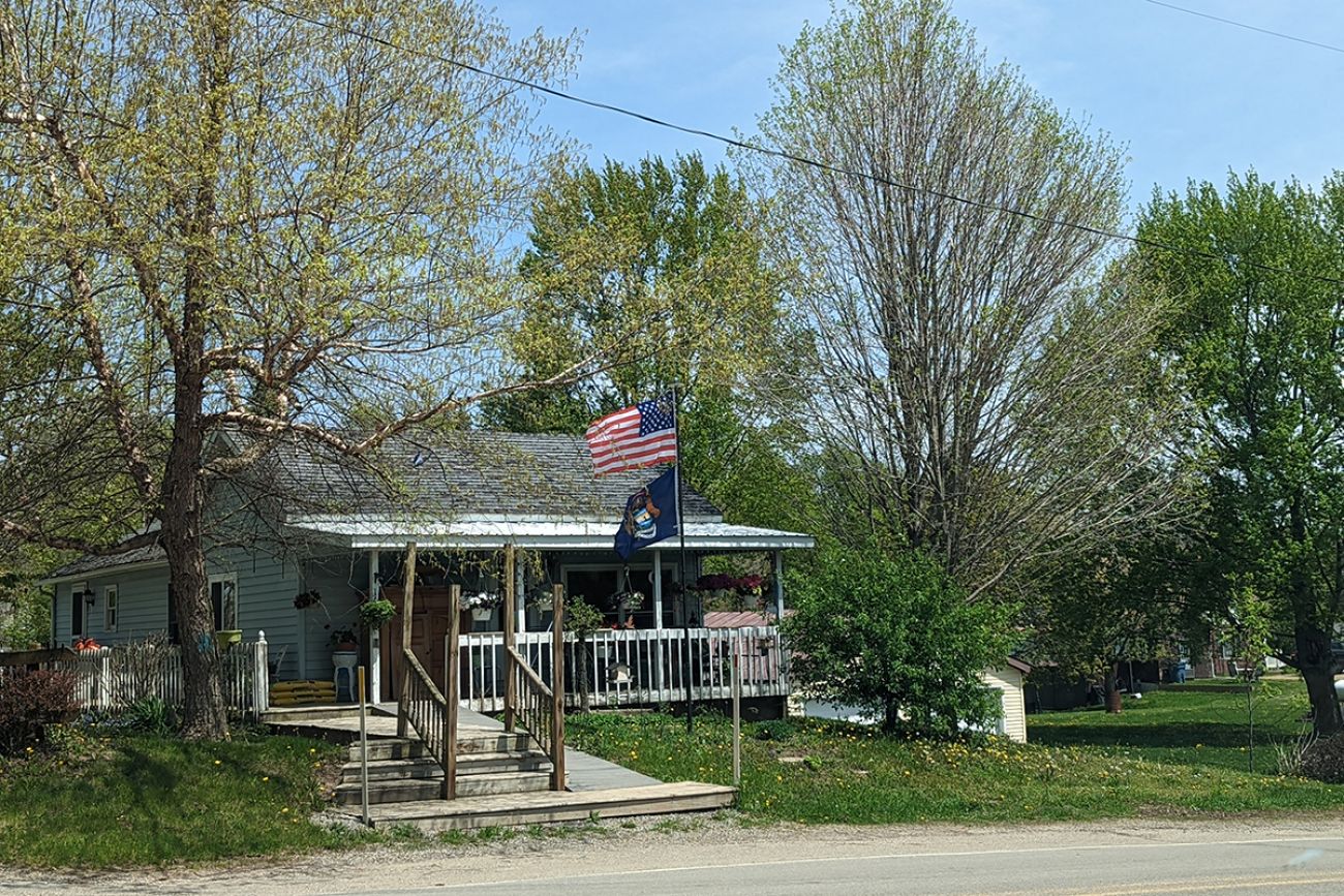 Michigan flag in front of home