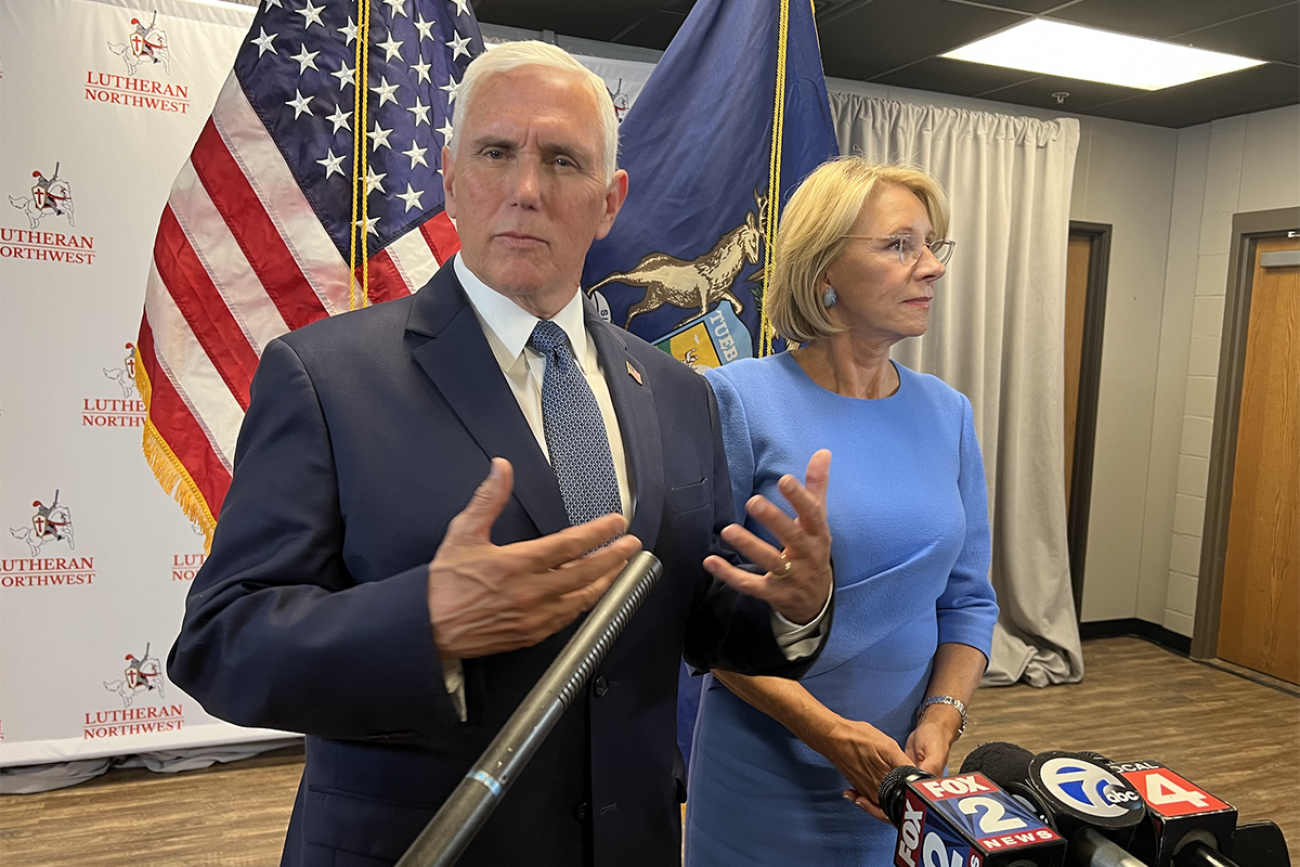 Mike Pence next to Betsy DeVos 