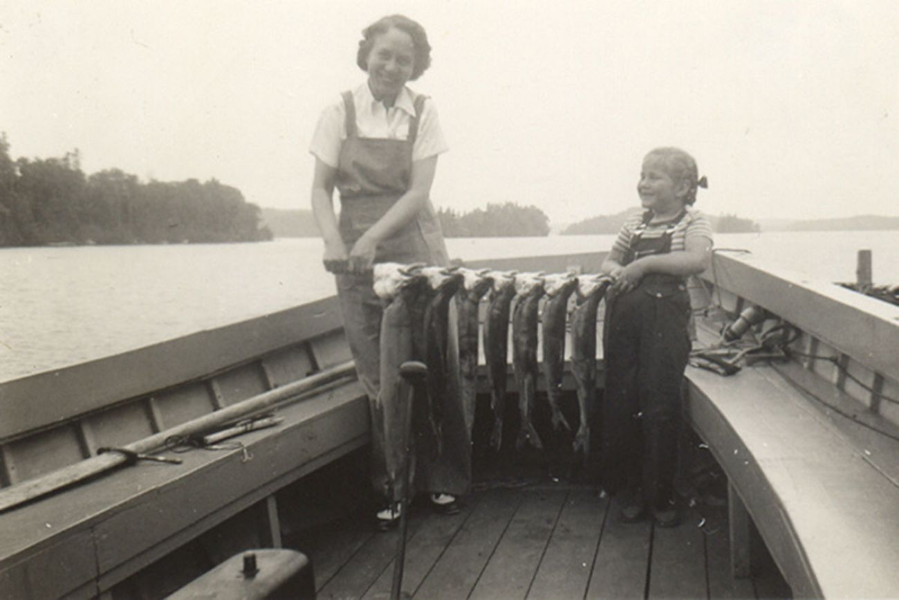 historic photo of two women in a boat