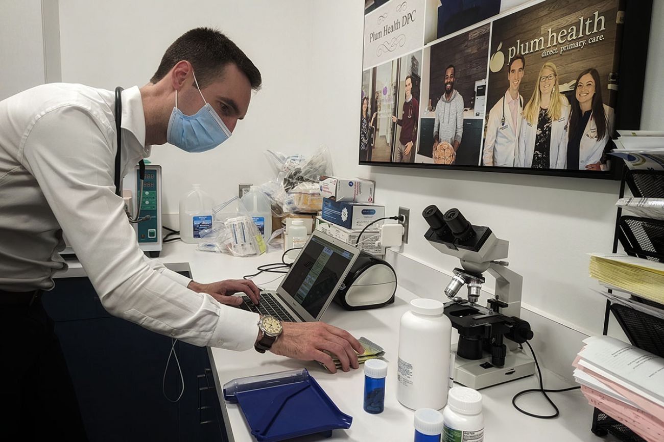 man looking at a computer in research