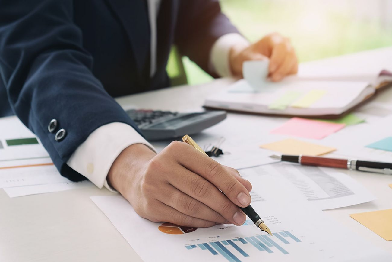 man with charts on table