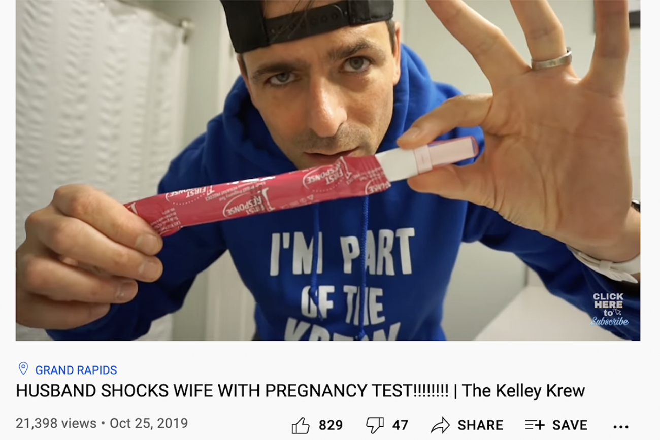 Ryan Kelley holding a pregnancy test