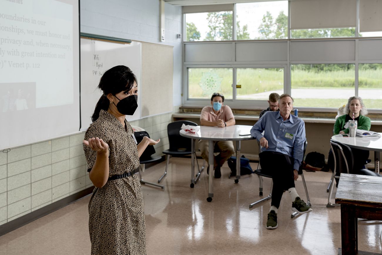 teacher in a mask with students