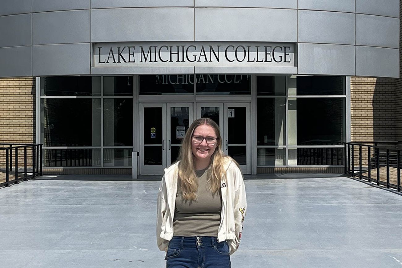 woman standing in front college