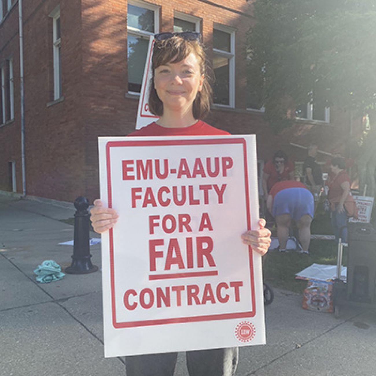 woman holding sign