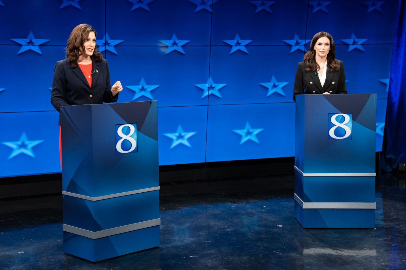 Gov. Gretchen Whitmer and Republican challenger Tudor Dixon on a debate stage