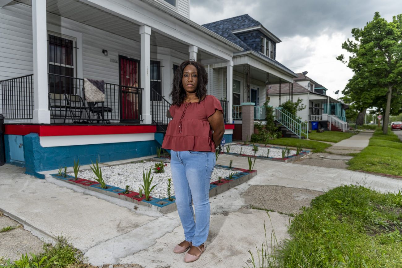 woman in front of a house