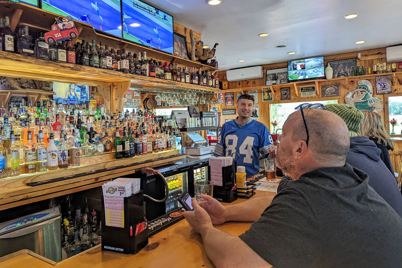 Tom Barrett at a bar with a lions jersey
