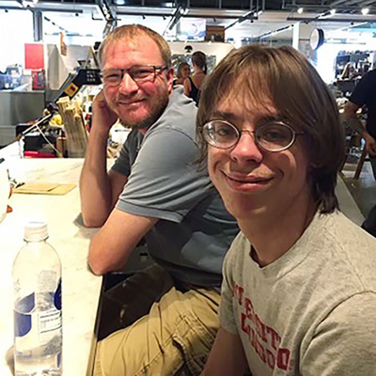 two people sitting next to each other