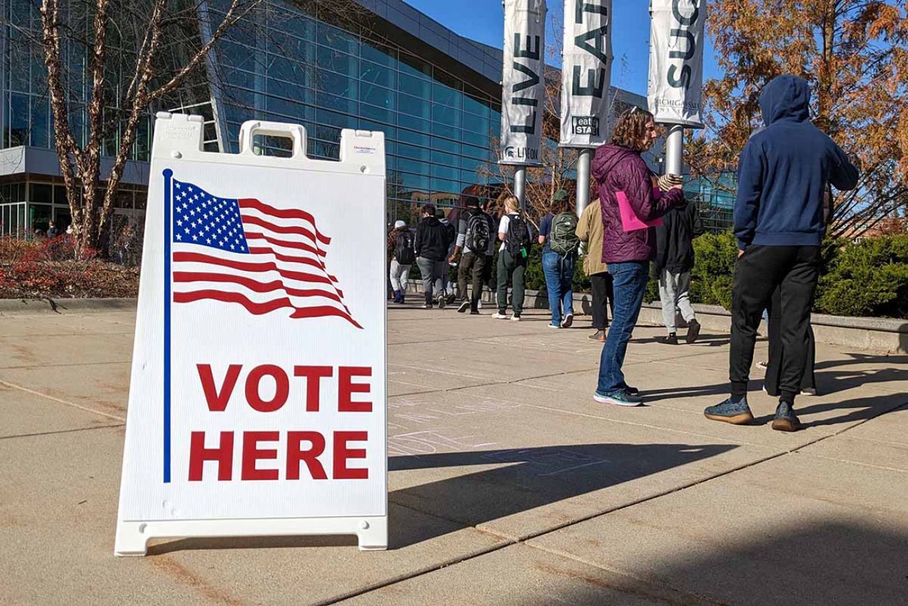 people standing in line to vote