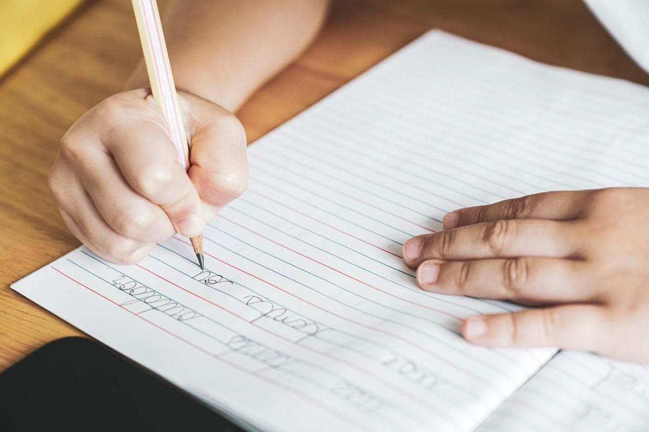 child doing cursive