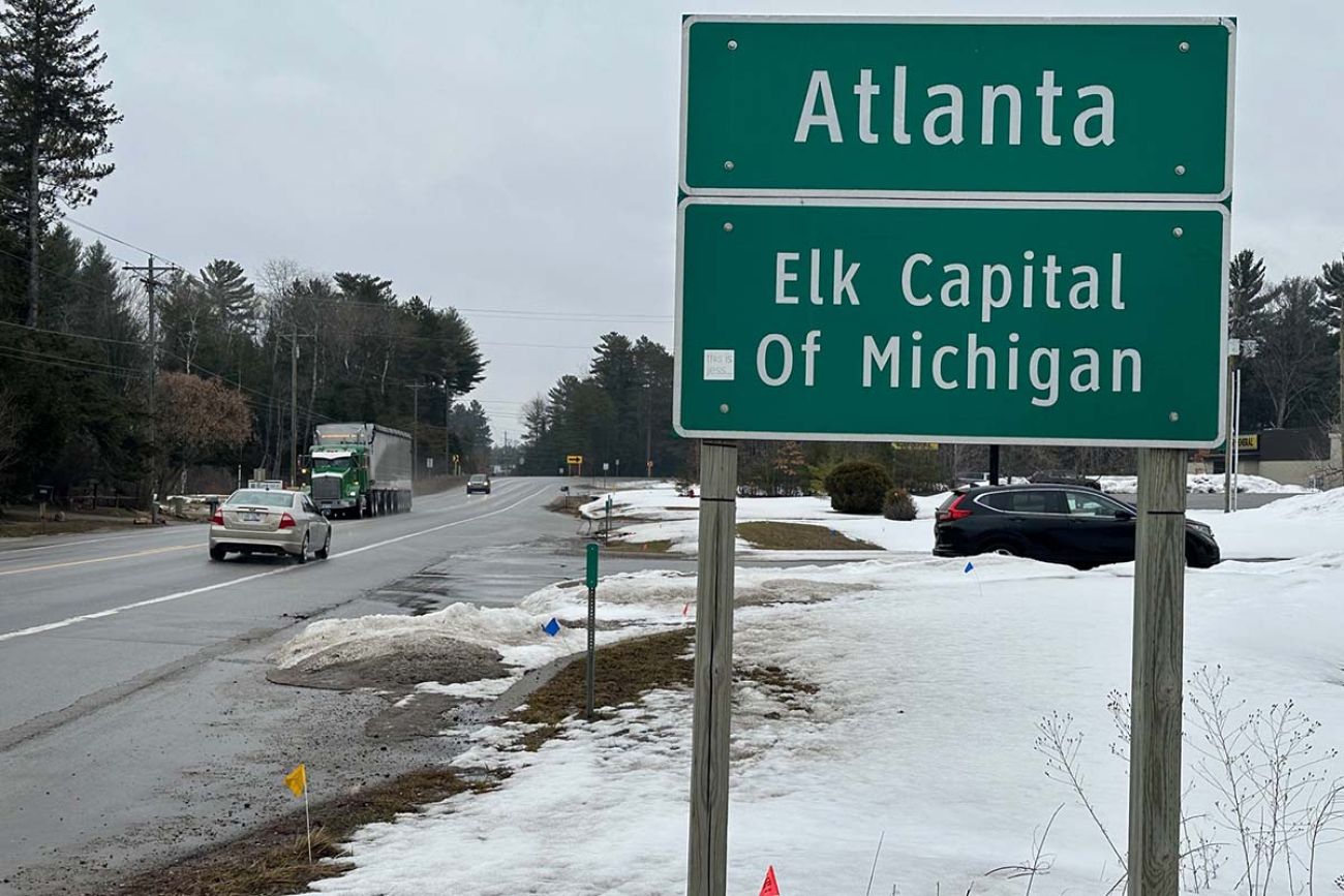 sign that says "Atlanta Elk Capital of Michigan"