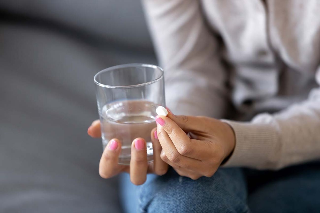 woman about to take pill 