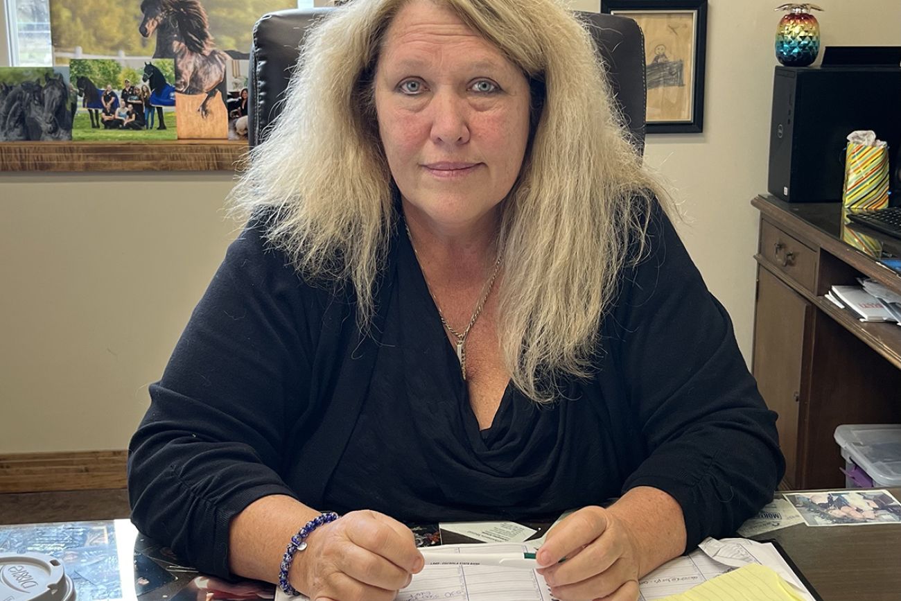 Lori Calka-Brock sitting at a desk