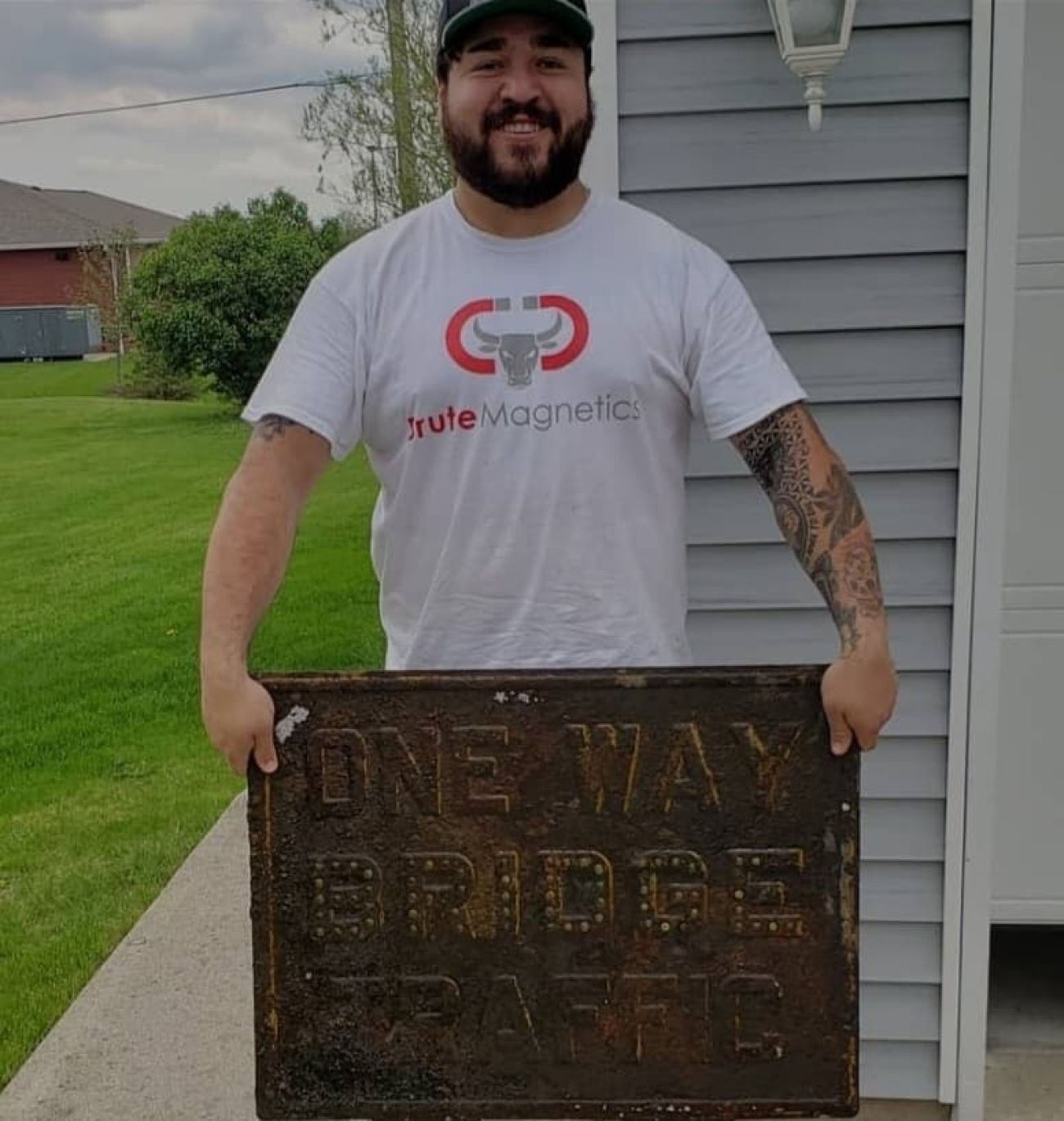 man holding magnet sign