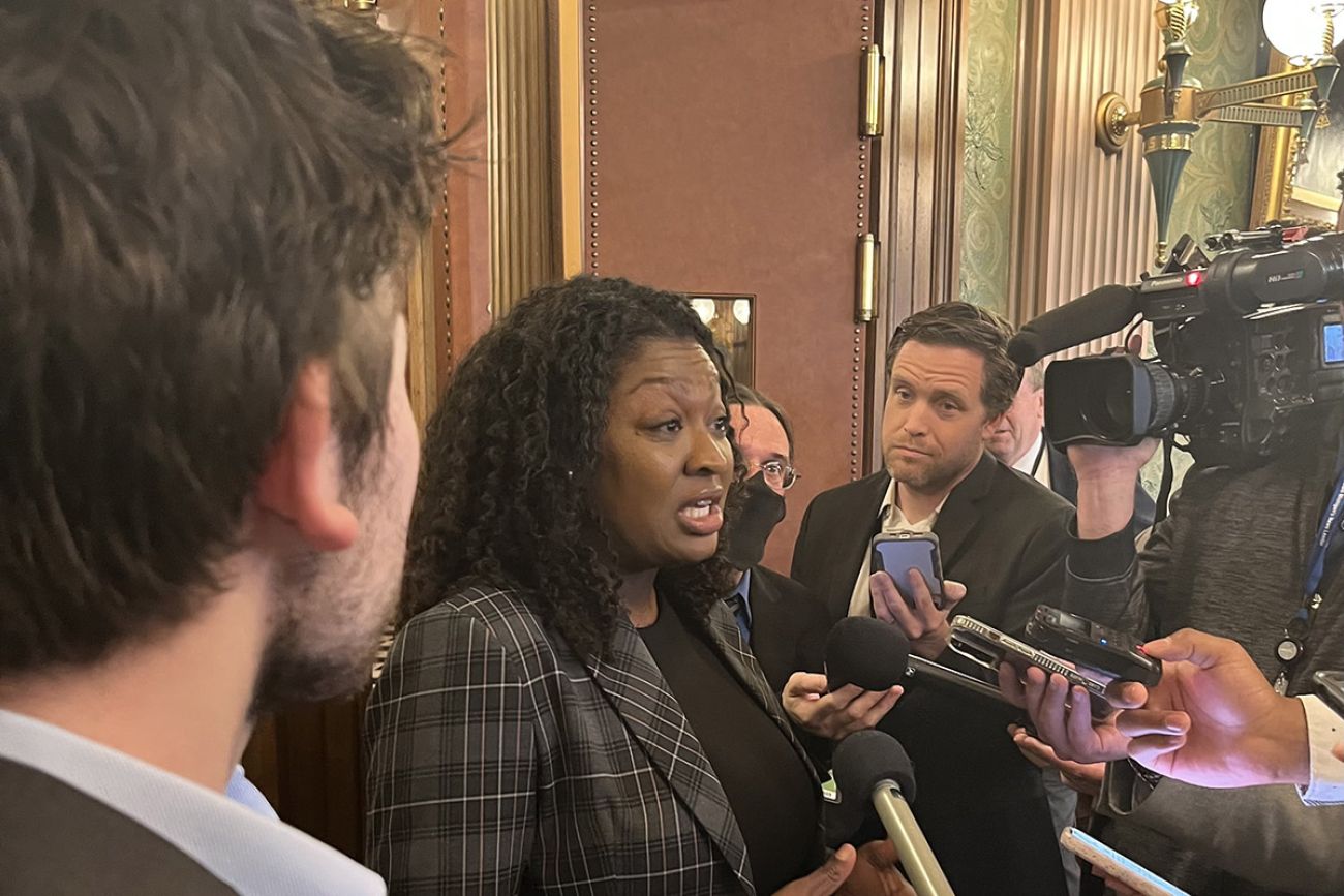 State Sen. Sarah Anthony surrounded by reporters