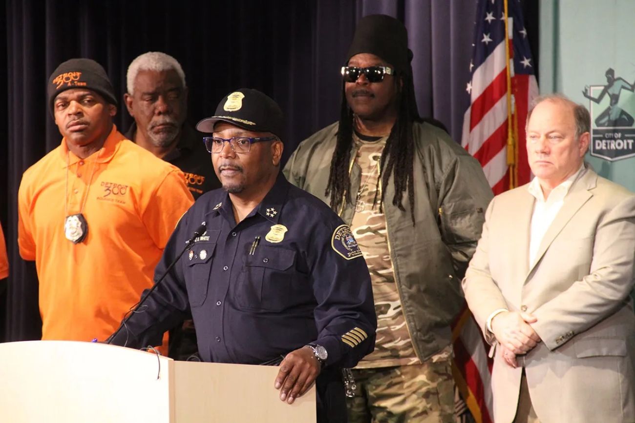 Detroit Police Chief James White surrounded by people at a press conference