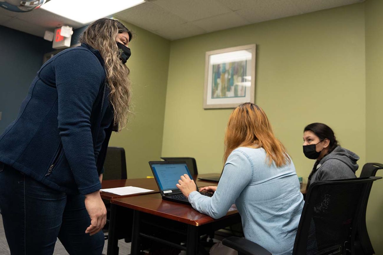 people around a desk