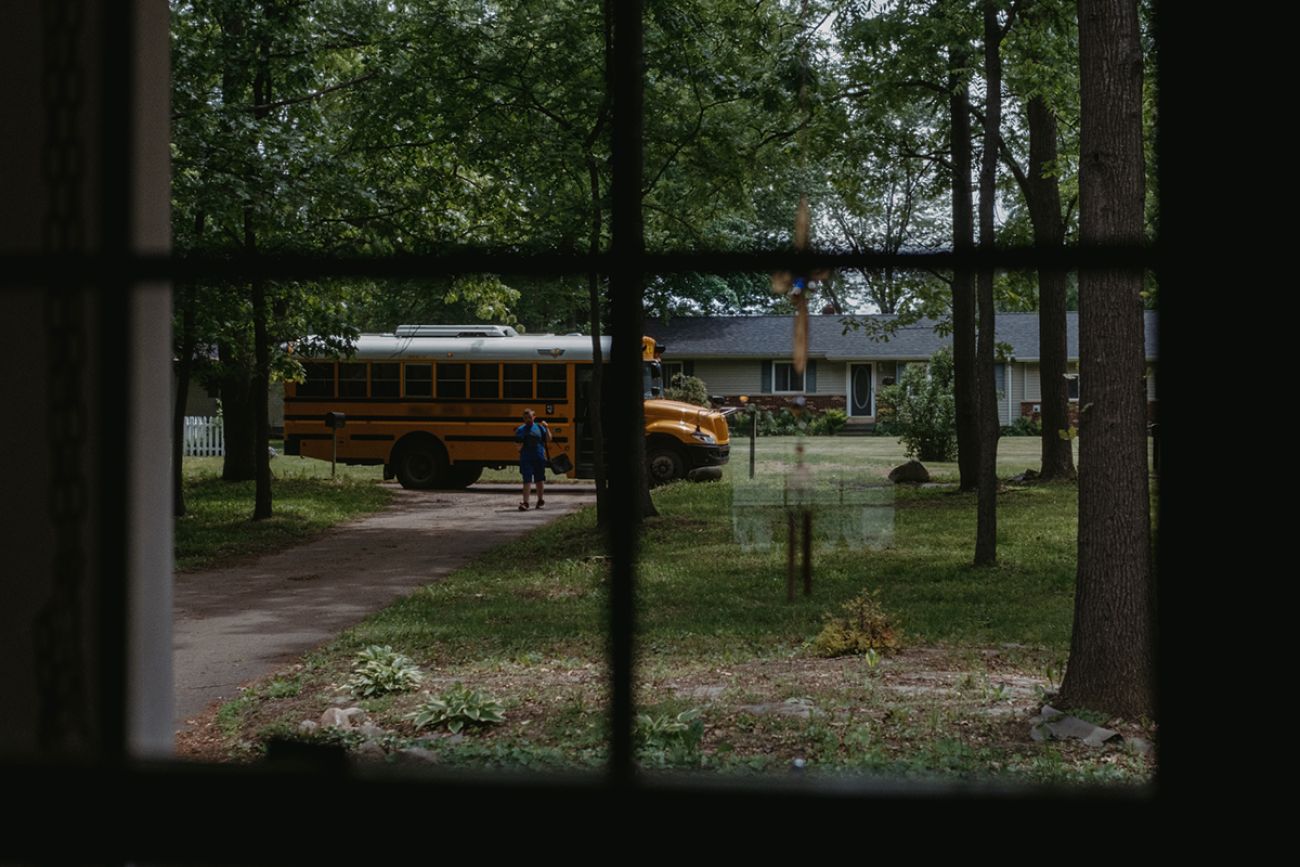 kid walking out of school bus