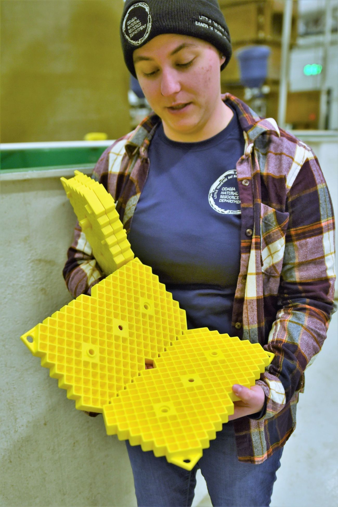 Kelsi Wygant holds a plastic incubator