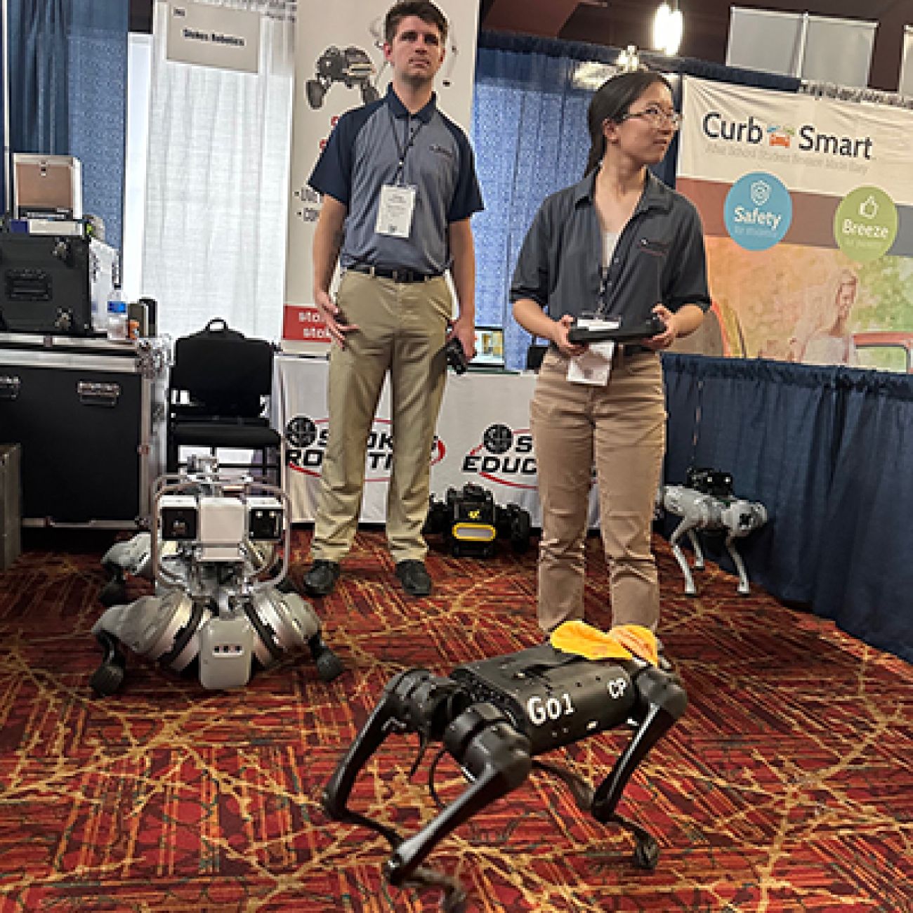 people standing next to robots
