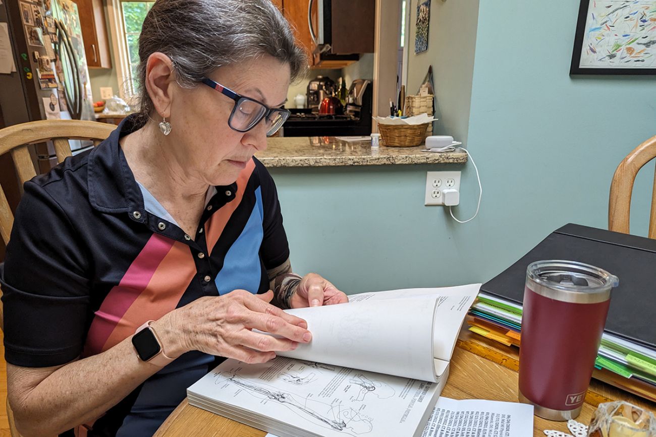 Rene Shireman looking at documents