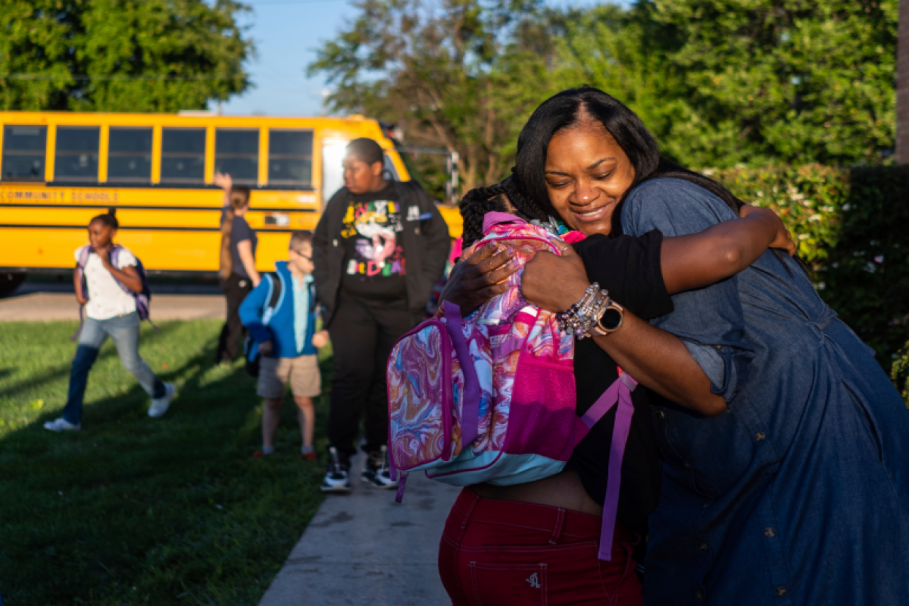 Woman hugs her child