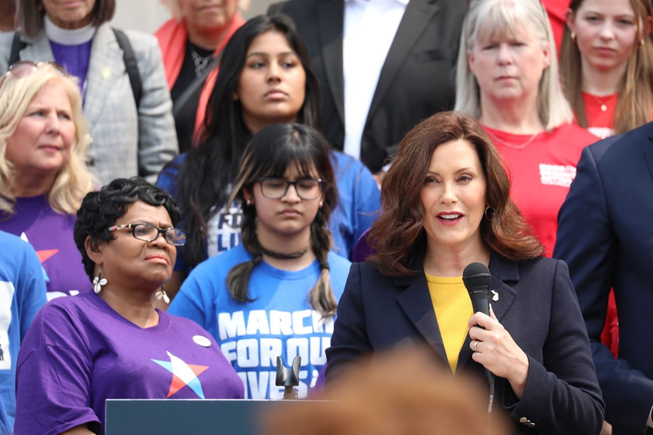 Michigan Gov. Gretchen Whitmer talking on microphone 