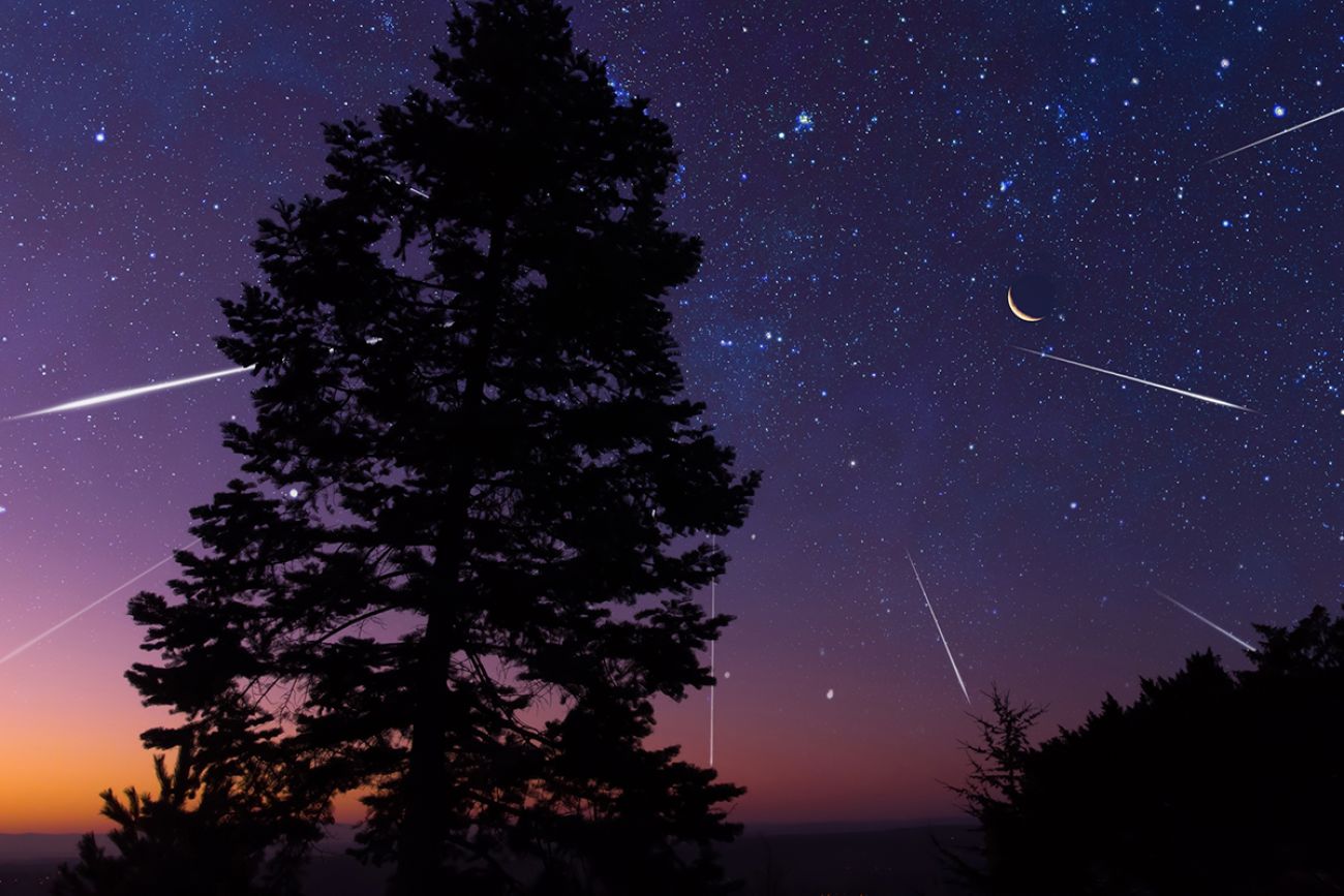 Starry Milky Way skies with comet and meteor shower, falling and shooting stars.
