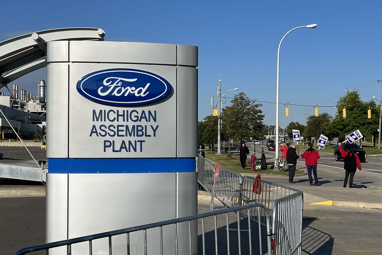 people in front of the ford assembly plant