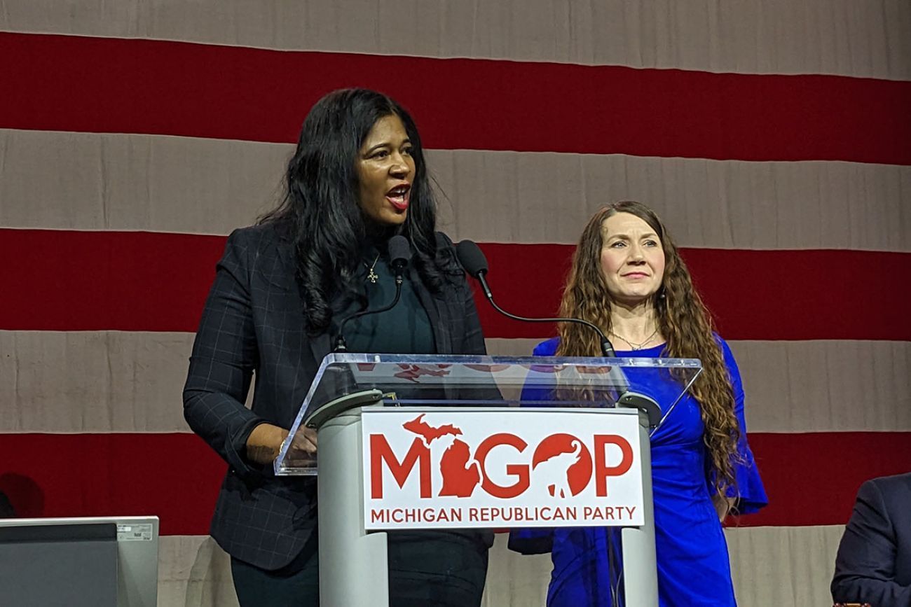 Michigan Republican Party Chair Kristina Karamo speaking into a microphone