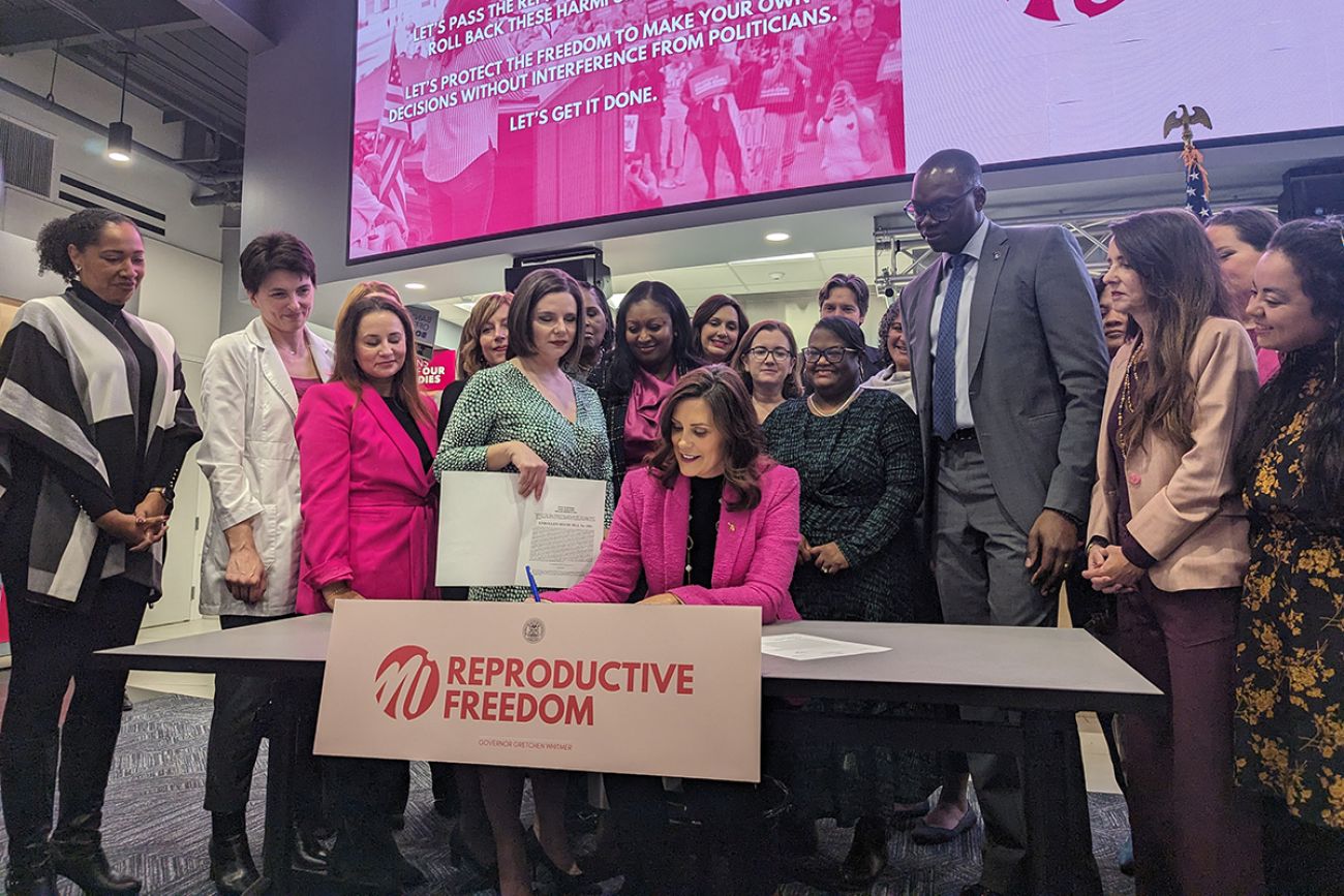 Gov. Gretchen Whitmer signing the "Reproductive Health Act"